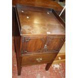 A George III mahogany bedside cupboard, circa 1780, the three-quarter galleried  top above a pair of