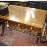 A George IV mahogany sofa table, circa 1825, the banded rectangular top with canted corners above