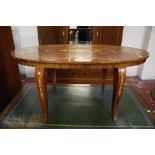 An oval floral inlaid coffee table