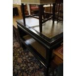 A pair of ebonised and caned coffee tables each 110cm length and a yew-wood coffee table, mid 20th