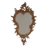 A Continental giltwood, cartouche shaped, wall mirror, circa 1880, 60cm high