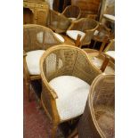 A set of twelve Louis XVI style beech bergères, the curved caned backs and seats on fluted turned