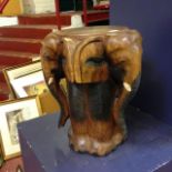 A carved wooden elephant mask stool, 46cm high