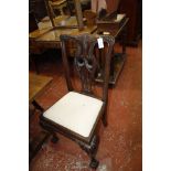 A pair of mahogany armchairs in George II style, late 19th/early 20th century, together with two