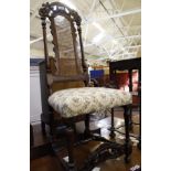 A late 17th walnut high back chair with carved crest rail with cane panel back, upholstered stuff
