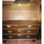 A George III oak bureau with two short and two long drawers 95cm wide