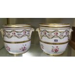 A pair of Mintons cache pots, floral decorated, 17.5cm high