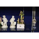 A quantity of porcelain figures to include a pair of putti etc