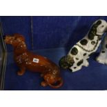 A pair of Staffordshire copper lustre spaniels and a Beswick Dachshund (3)