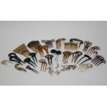 A collection of late 19th and early 20th century  haircombs and hairslides, including: faux