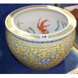 A late 19th/early 20th Century Chinese jardiniere with famille jaune and stylized floral