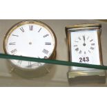 A carriage clock and a circular timepiece (both af)