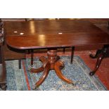 A Regency mahogany pembroke table on pedestal base 107cm wide