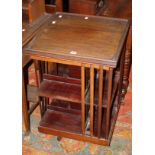 An Edwardian mahogany revolving bookcase 54cm wide