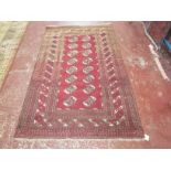 An Afghan rug 207cm x 130cm