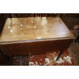 An early 19th century pembroke table, distressed