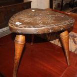 A pair of beech carved back stools and a stool decorated with dragons and armorials