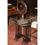 A Victorian toilet mirror with a circular plate and turned base and nest of mahogany tables