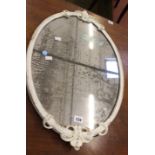 A grey painted oval mirror 67 x 44cm