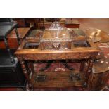 A late Victorian oak hall stand with carved detail 92cm wide