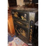 A Chinoiserie decorated cocktail cabinet with a mirrored interior and cupboard below on shell carved