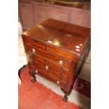 A Georgian mahogany commode on cabriole legs