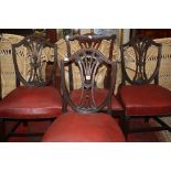 A set of three George III style mahogany shield back dining chairs and a further pair