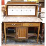 A late Victorian mahogany and crossbanded marble top washstand with a tile back 108cm wide