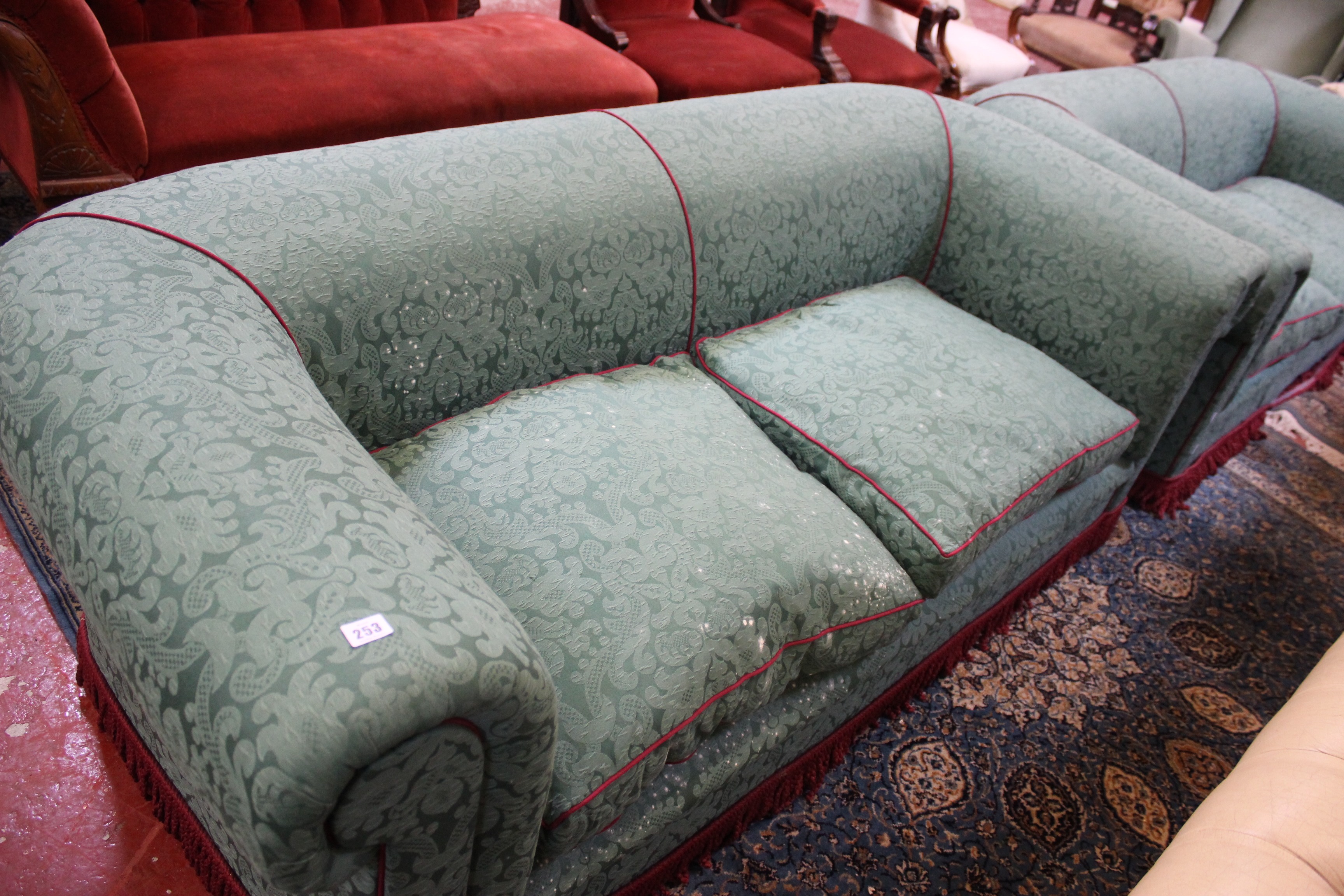 A pair of two green upholstered sofas each 201cm length