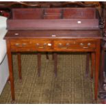 An Edwardian mahogany side table with two short drawers on square tapering legs 90cm wide