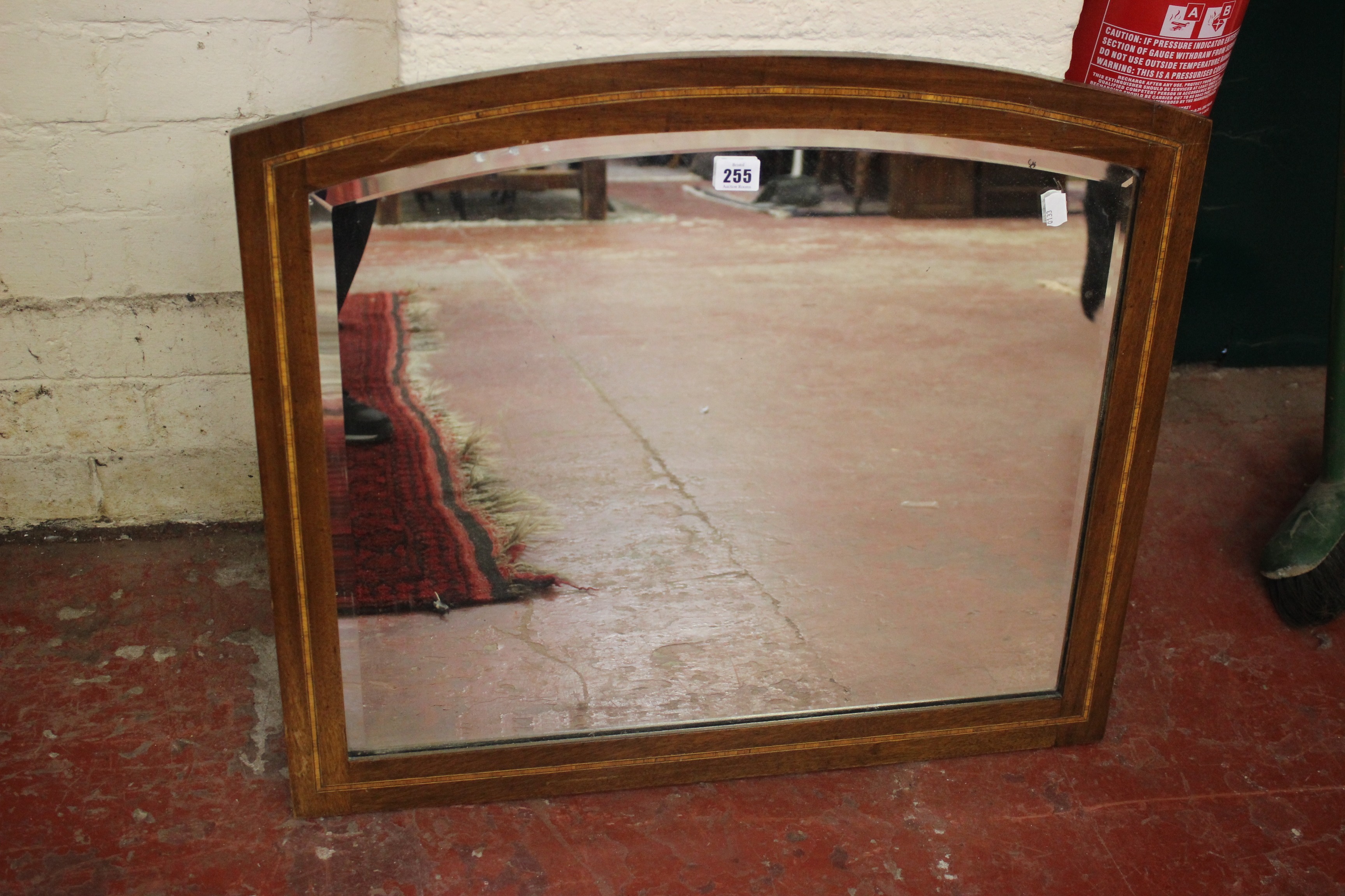 An Edwardian arched wall mirror and a modern gilt example