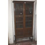 A 20th Century oak display cabinet on stand 82cm wide
