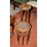 A carved oak octagonal table and a carved jardiniere stand