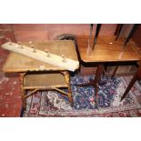 A wicker table, coat rack and Italianate style occasional table