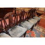 A set of six late George III mahogany dining chairs with shield backs