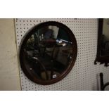 A George III mahogany circular framed mirror 52cm diameter