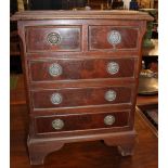 A George III style mahogany bedside chest 42cm wide and an oak occasional table