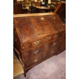 A George III figured mahogany bureau with three long drawers 103cm wide