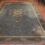 A large machine made carpet, in the Persian style, 20th Century 275 x 454cm and a pair of machine