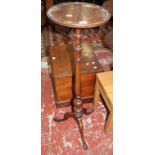 A late19th Century mahogany torchere on baluster turned column