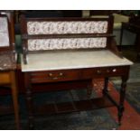 A late Victorian mahogany marble top washstand with a tile back 107cm wide