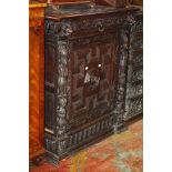 A late Victorian carved oak side cabinet with a frieze drawer and cupboard below 92cm wide