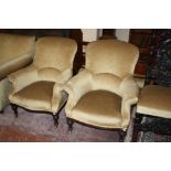 A near pair of Victorian upholstered armchairs