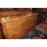 A George III mahogany and inlaid mule chest with a hinged lid, with four long drawers on bracket