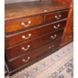 A 20th Century oak chest with two short and three long drawers 107cm wide
