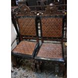 A pair of 17th Century style chairs with leather embossed seats