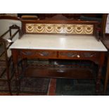 A late Victorian marble top washstand with swag carved frieze drawers 123cm wide and an Edwardian