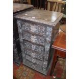 A late Victorian carved oak chest with six drawers with lion mask handles 54cm wide