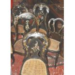 A pair of Victorian mother of pearl inlaid and gilt decorated japanned chairs, with caned seats,