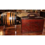 An oak sherry barrel on stand Williams & Humberts and a leather magazine rack